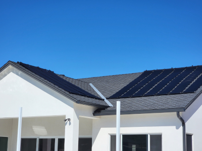 solar pool heating panel on a roof by pool