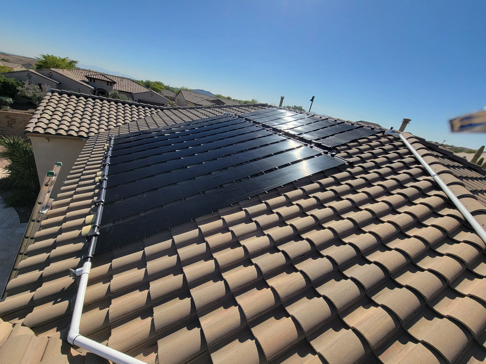solar pool heating on roof of house