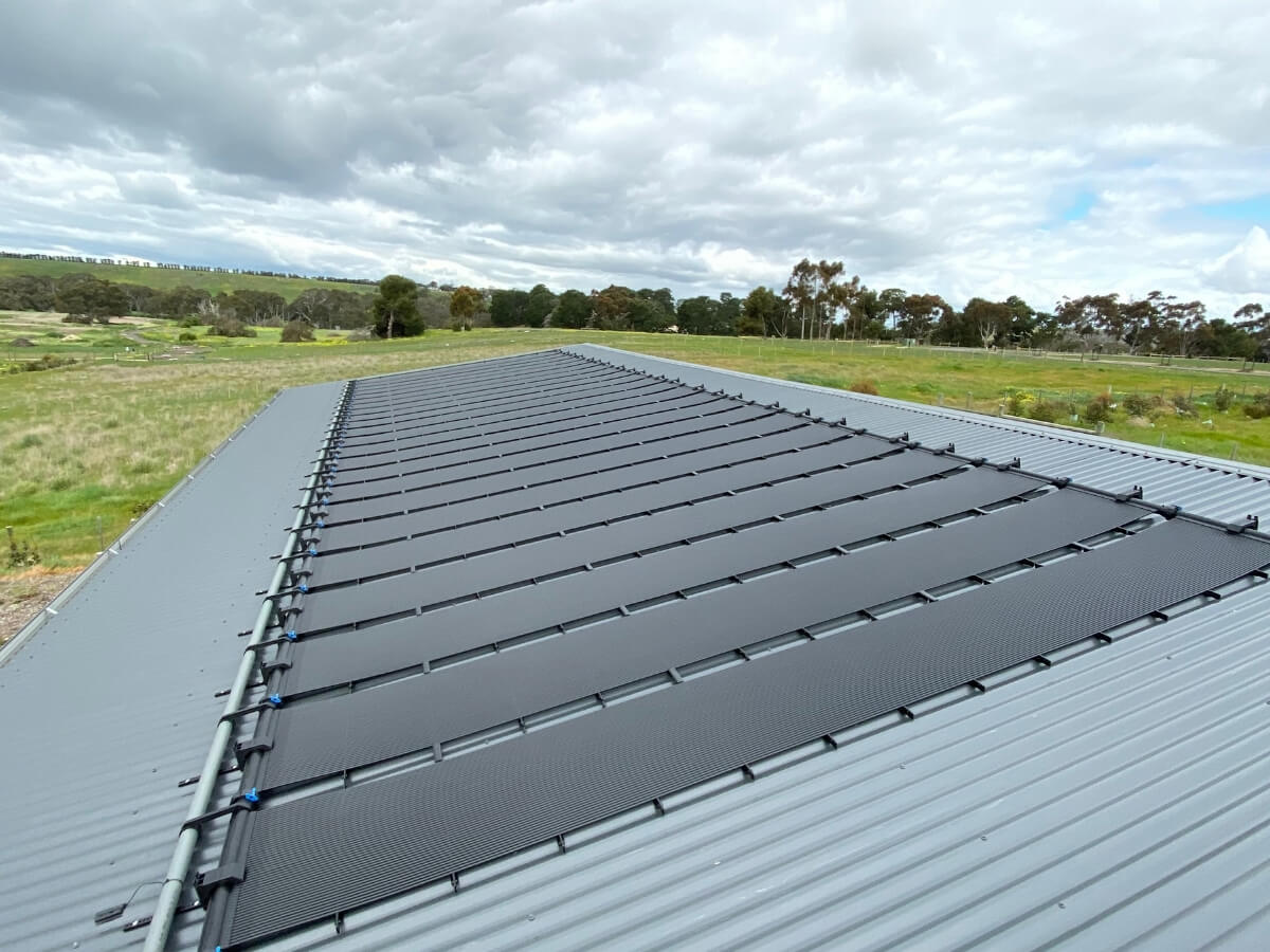 Sunsplash solar pool heating panel on roof